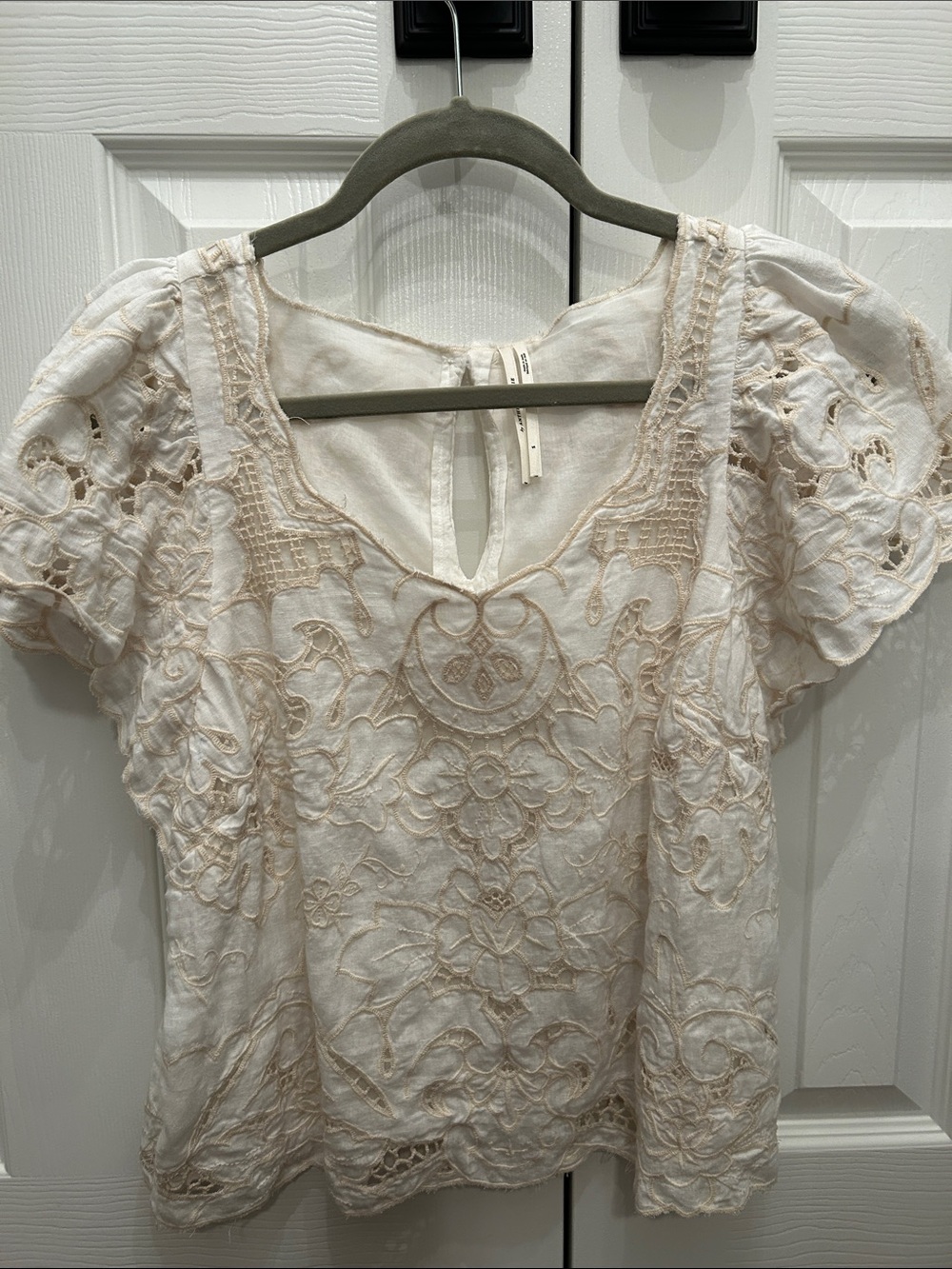 Women’s Anthropologie cream top. Never worn.